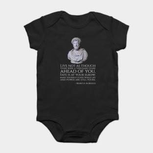 Live not as though there were a thousand years ahead of you. Fate is at your elbow; make yourself good while life and power are still yours. - Marcus Aurelius Baby Bodysuit